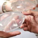 People holding breast implants